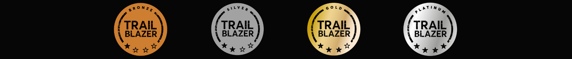 4x Trailblazer medals on black background